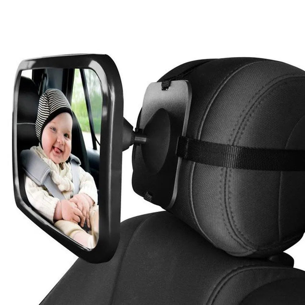 Black baby rear view mirror attached to car headrest with adjustable strap and wide rectangular shape