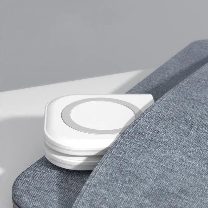 White folding dual magnetic desktop wireless charger with two USB Type C ports on a desk