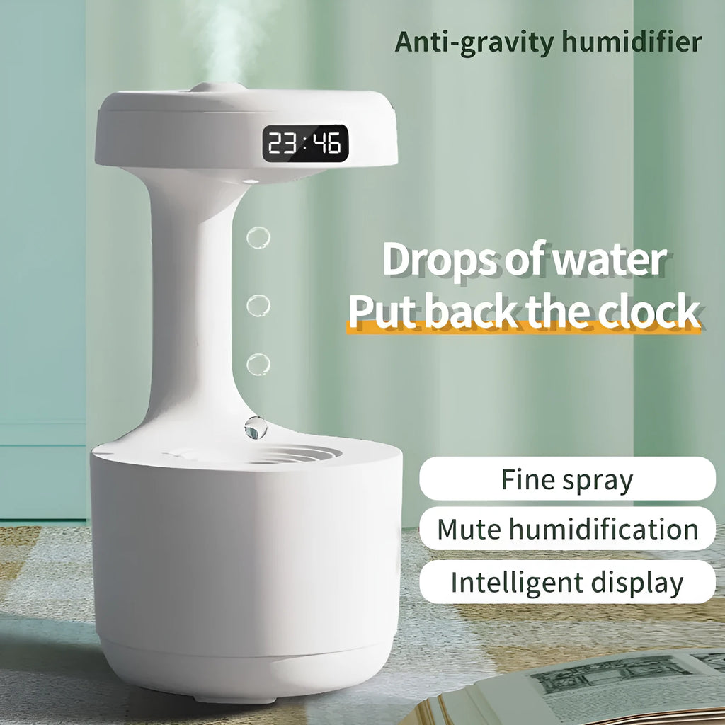 White anti-gravity humidifier with LED clock display emitting mist on a wooden desk.