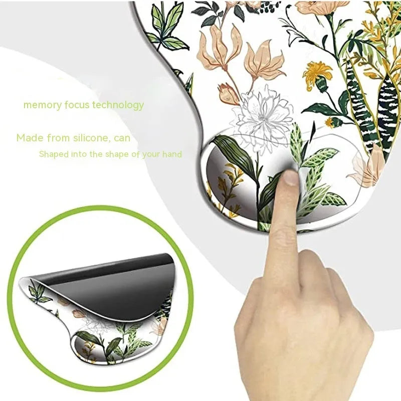 Black silicone keyboard pad with wrist strap and floral pattern, rubber sole visible underside