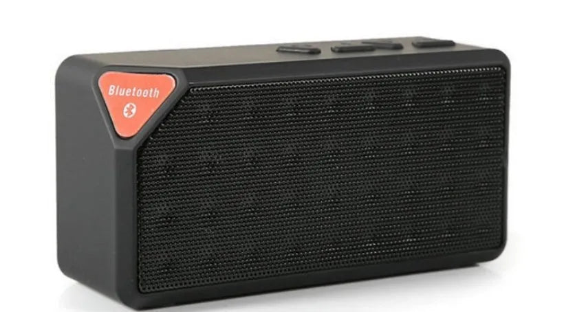 Small cube-shaped Cannon X3 wireless Bluetooth speaker in one of five colours: black, blue, green, red, or yellow.