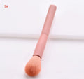 Ten professional makeup brushes with wooden handles including powder, foundation, and double-ended brushes.