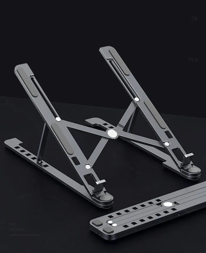 Foldable aluminium laptop stand in silver, shown open at an angle and folded flat.