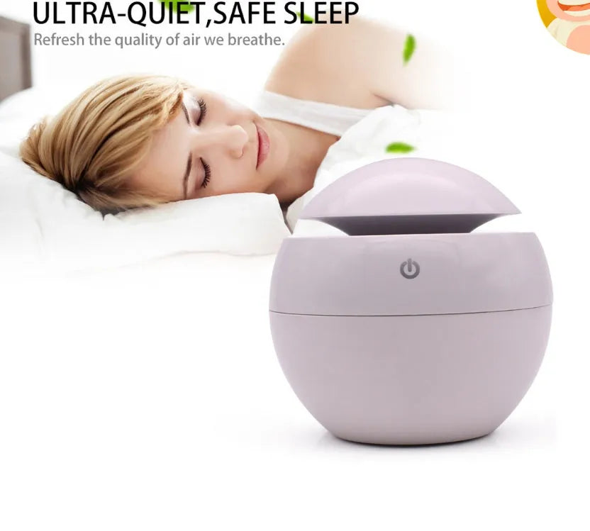 USB ultrasonic atomizer with colourful light and 130ml water tank in white colour option on a wooden desk