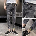 Men's blue denim jeans with high waist, button fly, and straight leg design on hanger