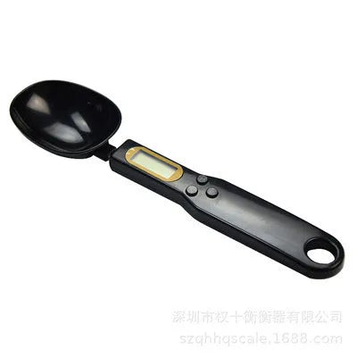 White digital spoon scale with LCD display showing weight measurement for kitchen use