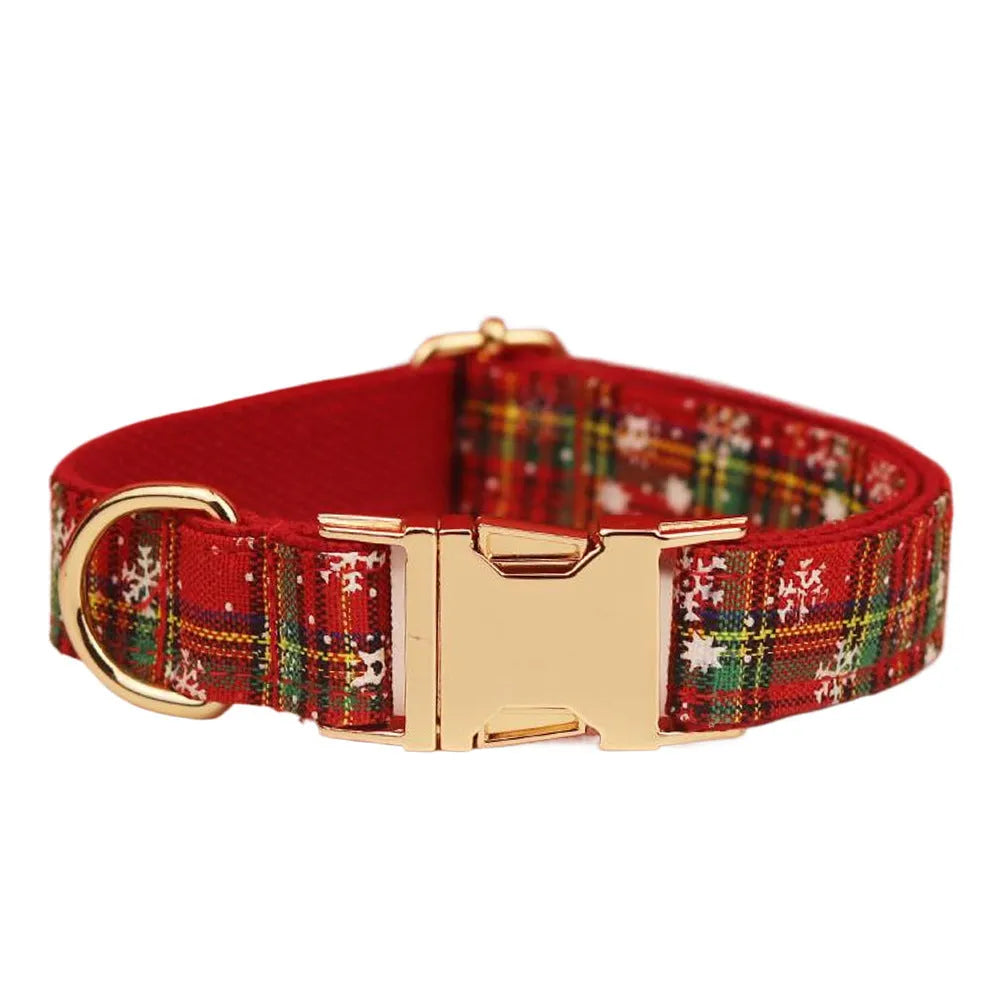 Red Christmas dog collar and leash set with snowflake design, plaid rope, floral bows, and matching vest