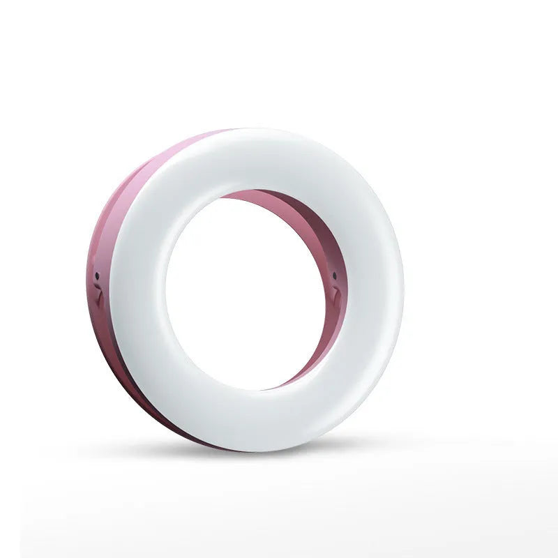 Compact black ring light for smartphone photography with USB charging cable.