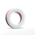 Compact black ring light for smartphone photography with USB charging cable.