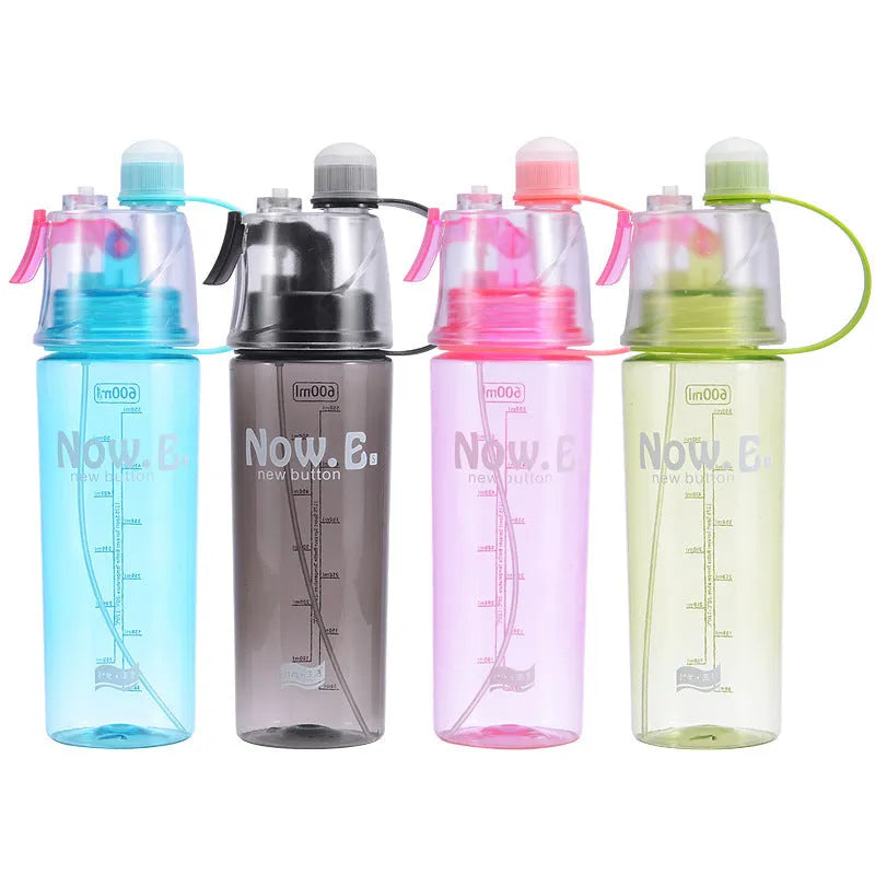 Green portable sports mist spray cup with handle, spray nozzle, and visible water level scale.
