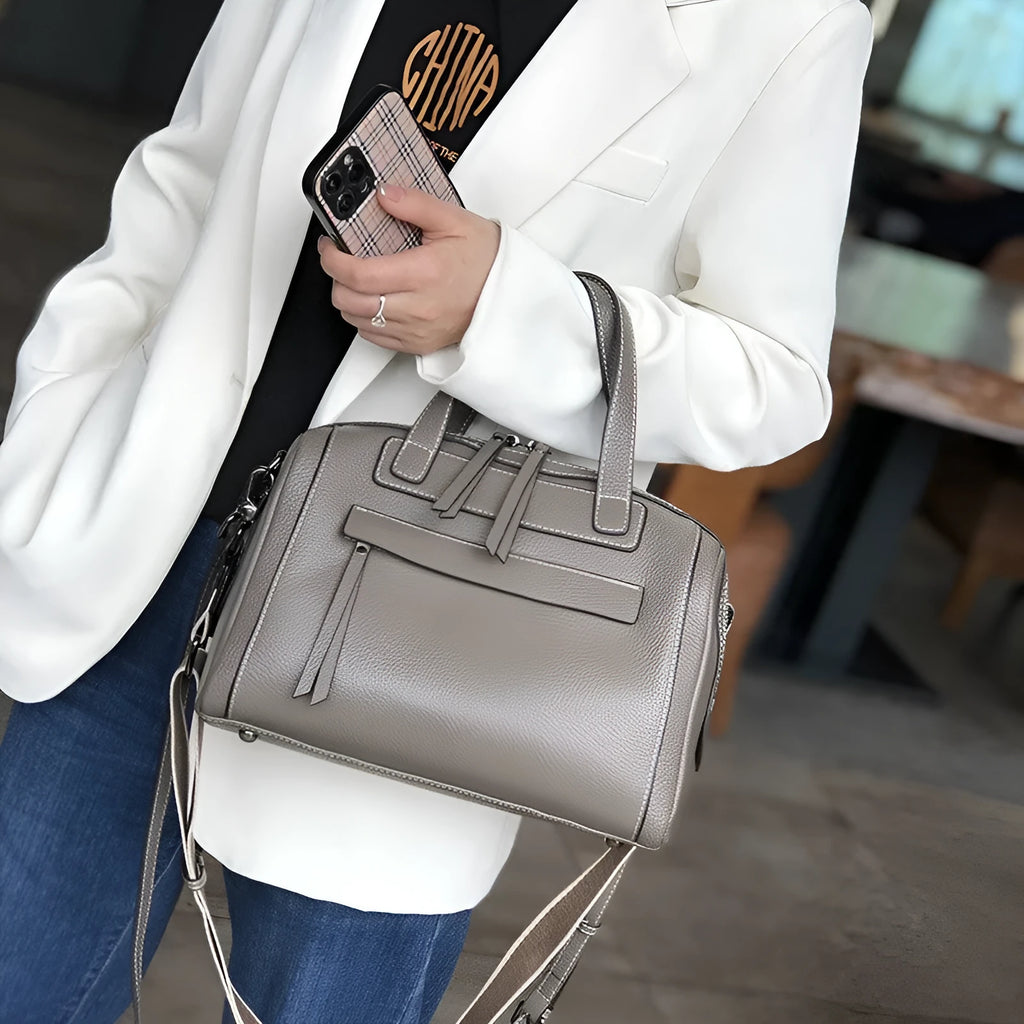 Genuine leather shoulder messenger bag with lychee pattern texture in horizontal square shape showing interior organisation compartments