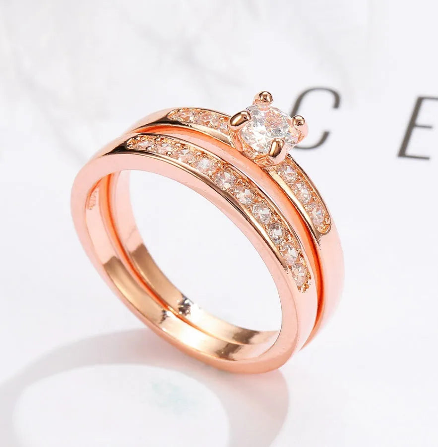 Rose gold ring with diamonds on a copper band, available in US sizes 5 to 12