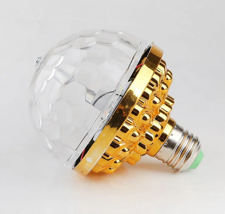 LED colourful rotating magic ball light with 6 RGB beads and lamp holder on a table