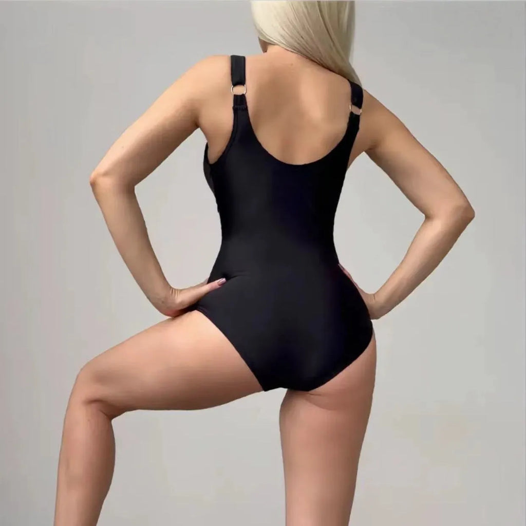 Women's black nylon lace-up tight one-piece swimsuit on plain background