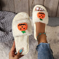 Pumpkin plush slippers with cartoon design, synthetic fur upper and PVC sole
