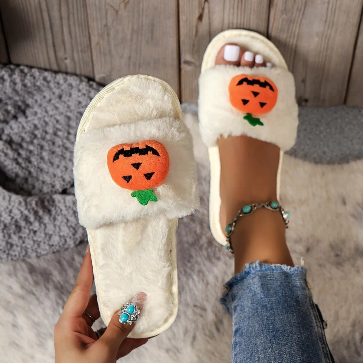 Pumpkin plush slippers with cartoon design, synthetic fur upper and PVC sole