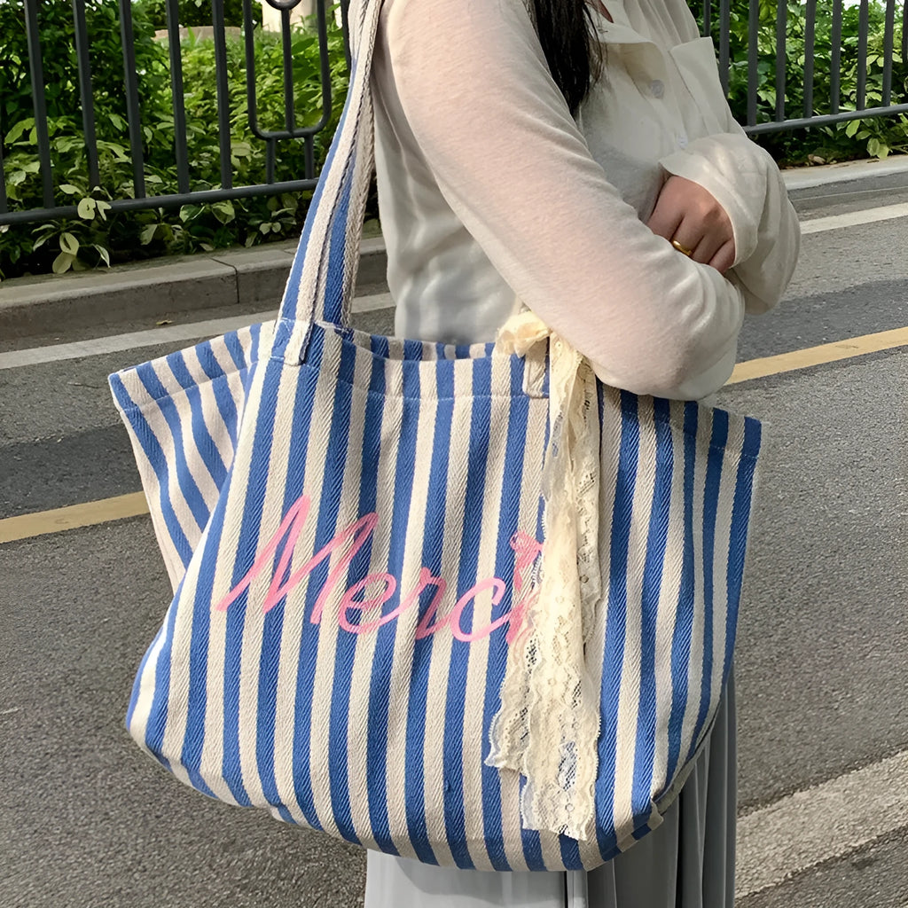 Blue striped letters printed on pink blue and white striped cotton canvas bag