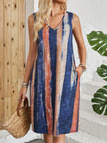 Women's V-neck sleeveless vest dress with colour block striped pattern in a midi length.