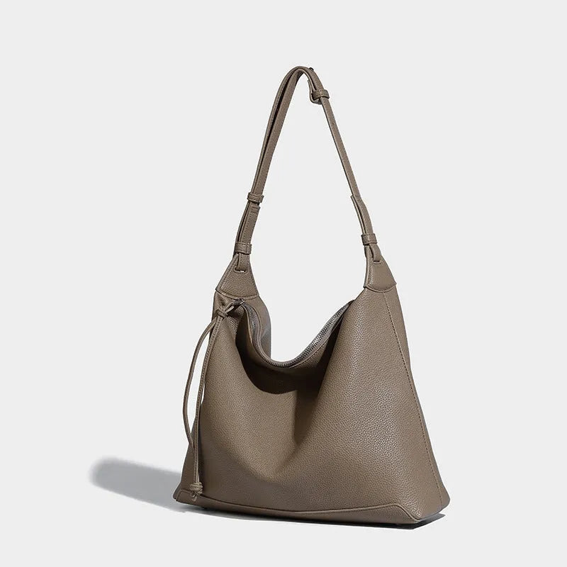 Soft PU messenger bag in caramel colour showing 36cm length and underarm shoulder strap