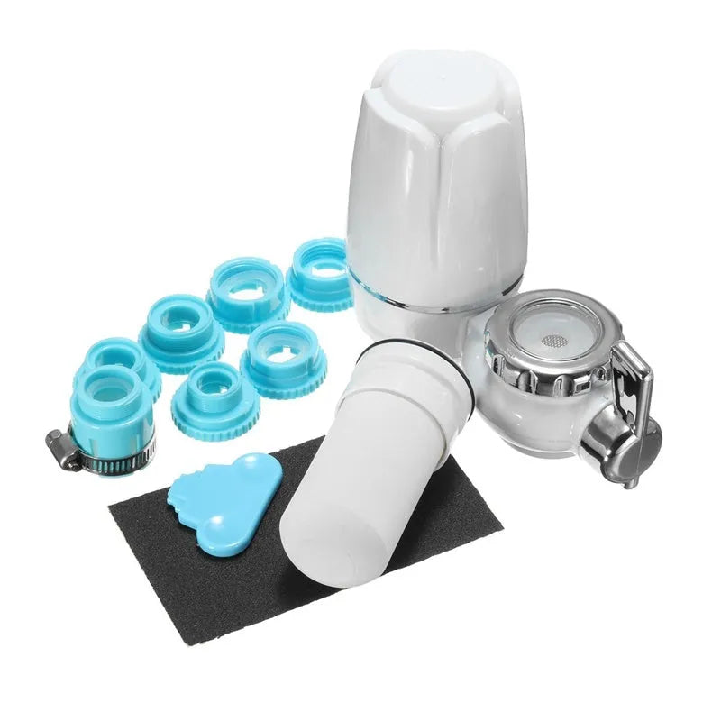 White plastic faucet water purifier with ceramic filter cartridge mounted on kitchen tap