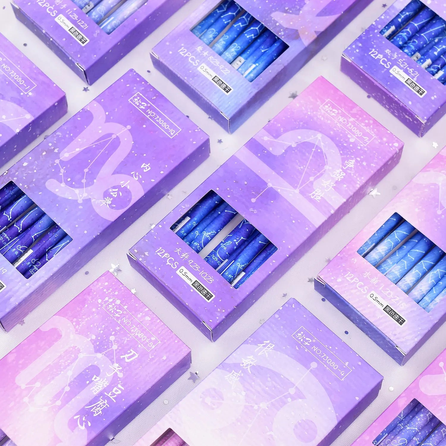 Box containing twelve constellation themed quick-drying gel pens for office use