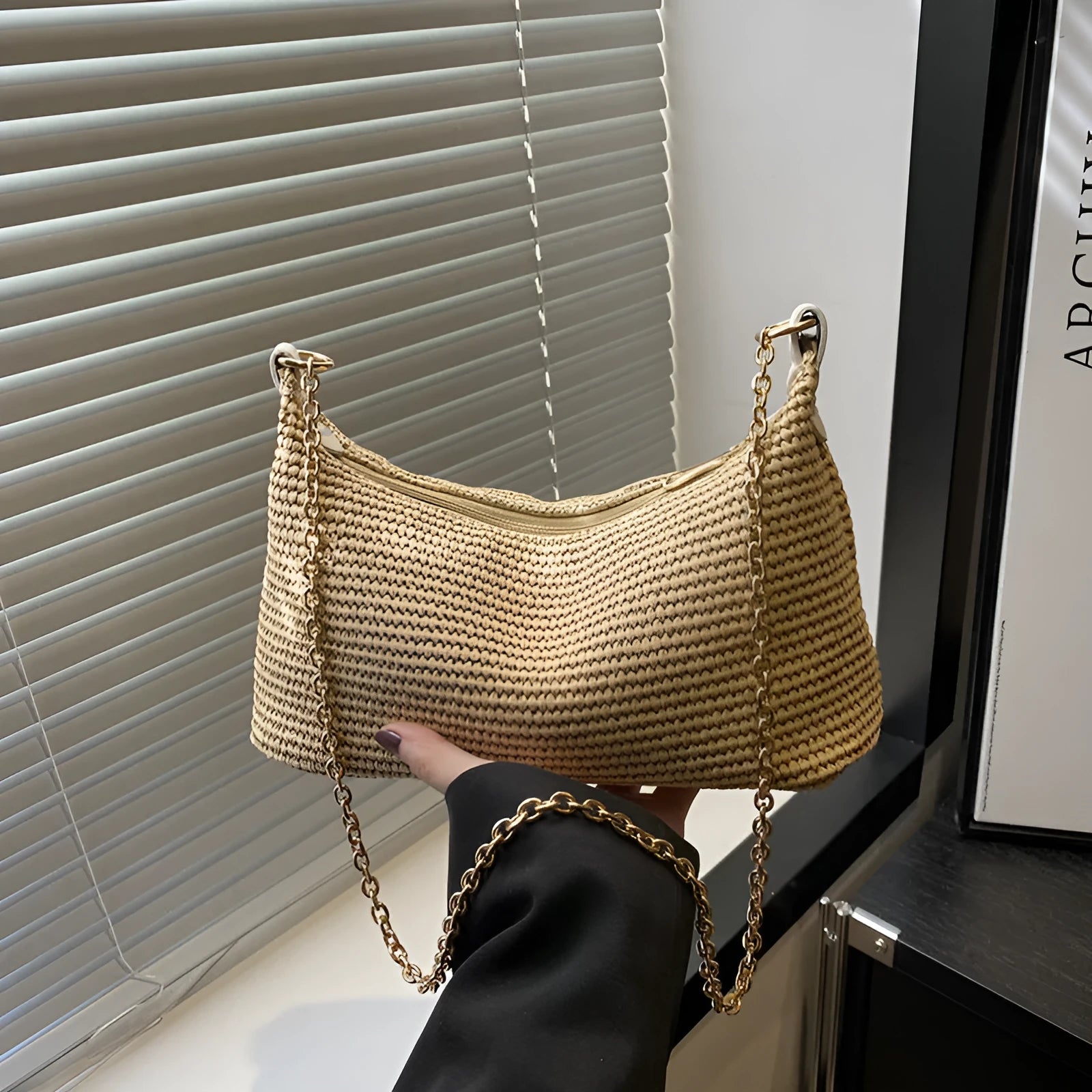 Woven straw shoulder tote bag in khaki colour with sandwich pocket design and internal phone compartment