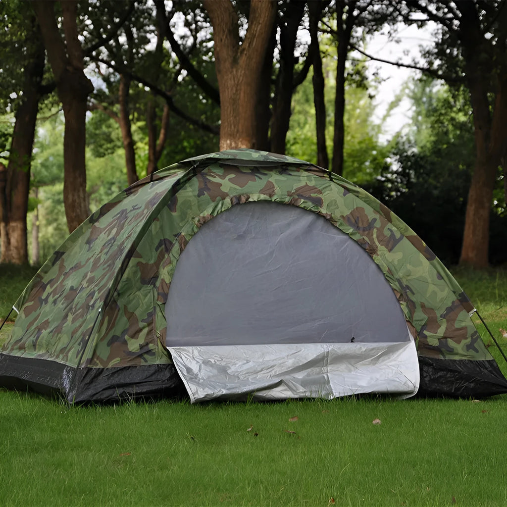 Green camouflage tent with triangular skylight and fibreglass poles set up outdoors