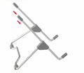 Grey foldable aluminium and plastic stand holding a mobile phone and a laptop on a desk.