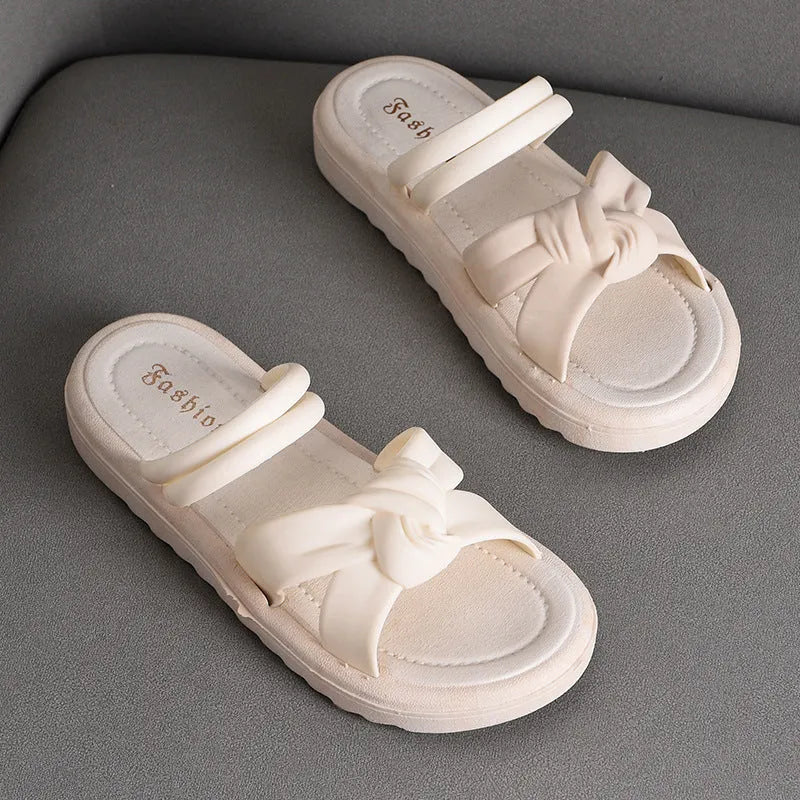 Women's black and white PVC sandals with a soft back, two-way strap design, and a non-slip sole.