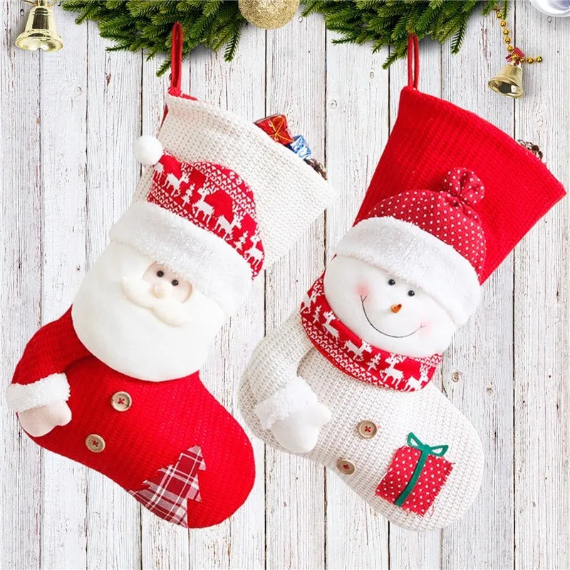 Large red and white knitted Christmas stocking with Santa Claus design hanging from fireplace