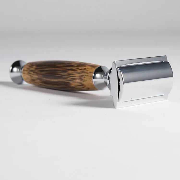 Natural bamboo handle double edged safety razor with silver metal head on light background