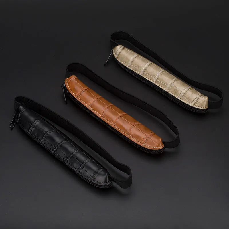 Long slim PU leather pencil case in beige grey, black, and crocodile print colours.