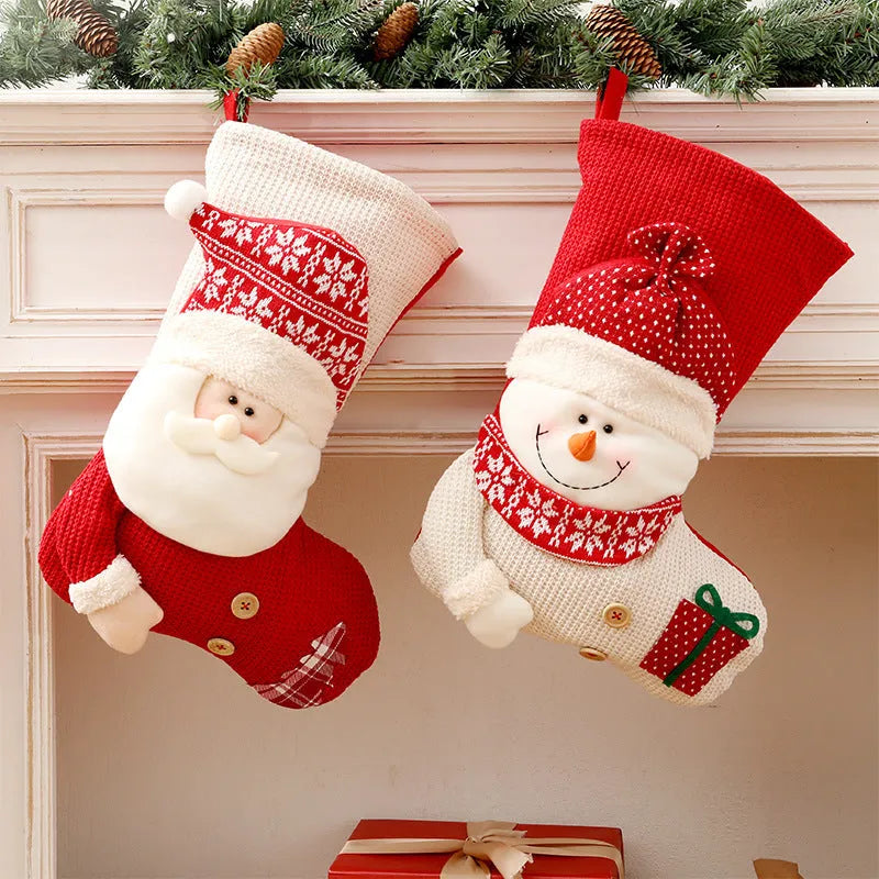 Large red and white knitted Christmas stocking with Santa Claus design hanging from fireplace