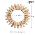 European style solid wood round hanging mirror in baked colour finish on a wall.