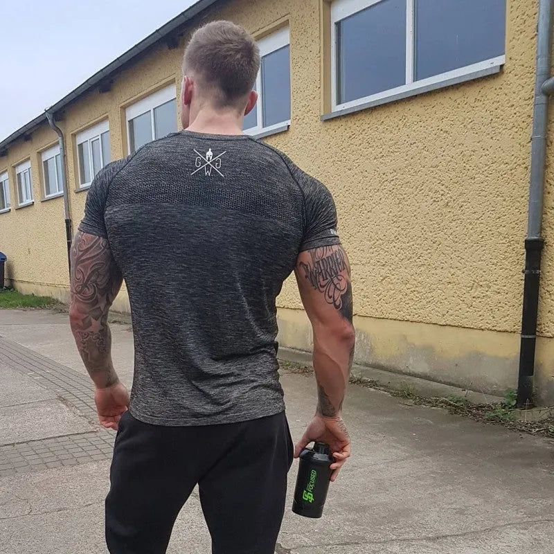 Men's short sleeve polyester workout top in orange colour for gym training