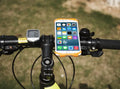 Silicone bicycle phone holder mounted on handlebars showing three adjustment holes