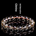 Natural citrine scattered beads ball bracelet showing polished beads in 7A and 6A colour grades.