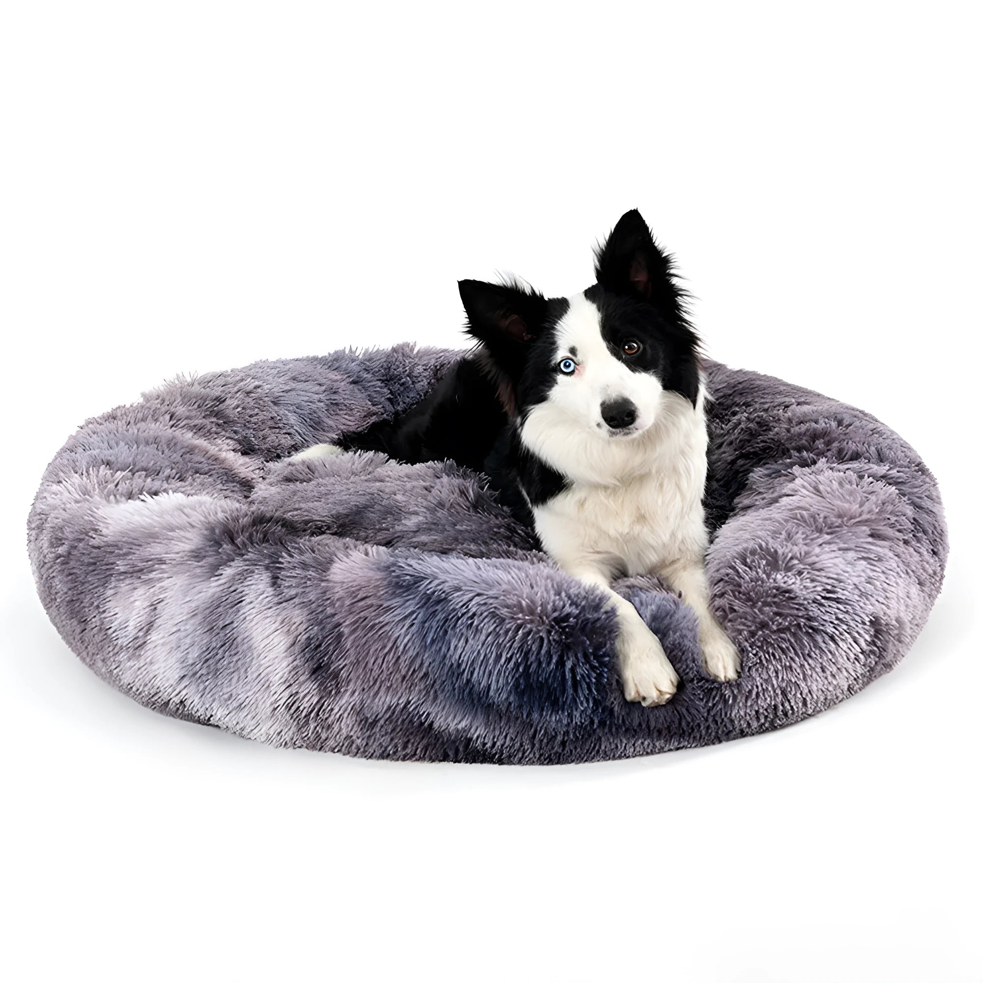 Fluffy donut-shaped dog bed in long plush fabric, shown in a light grey colour with raised edges.