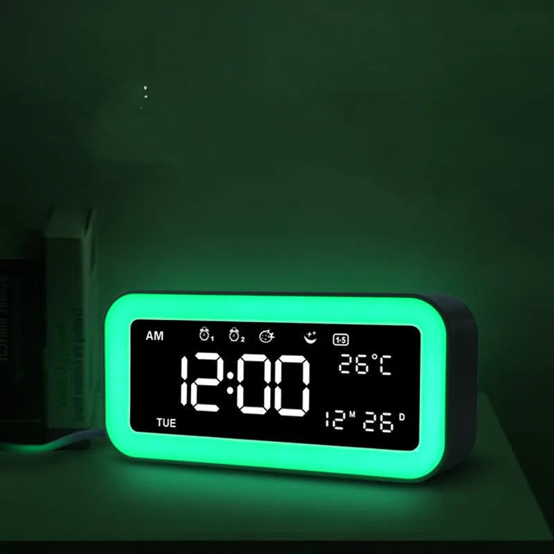 Rectangular blue LED atmosphere alarm clock with digital display on a wooden surface.