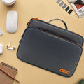 Grey three-layer polyester travel storage bag with sewing line detail, shown open.