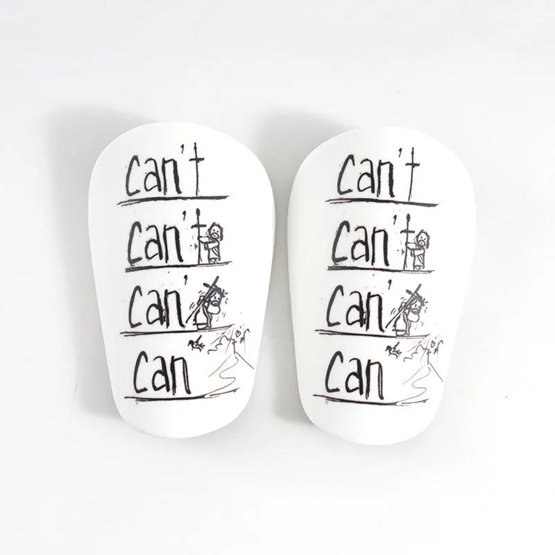 Pair of football shin guards for S and XS size in black, blue, white, or white-black colour.