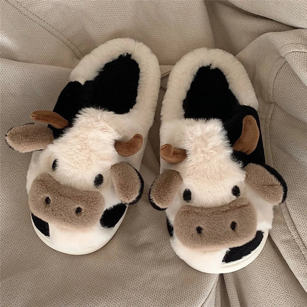 White cow-themed plush slippers for women with non-slip textured soles