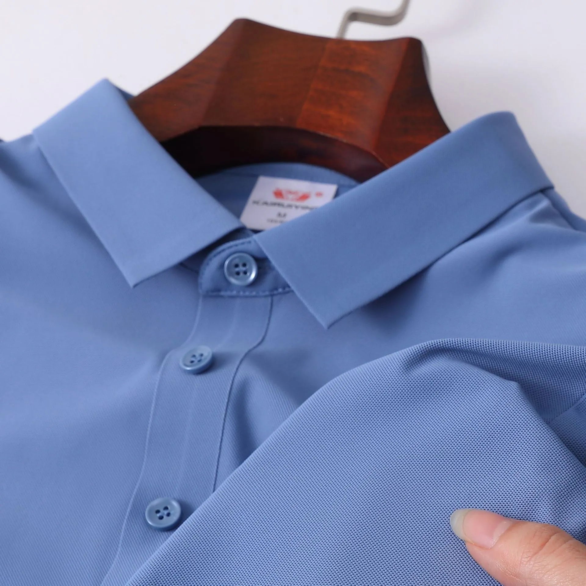 Men's ice silk seamless short sleeve polo shirt in solid colour, loose fit, nylon fabric, side view