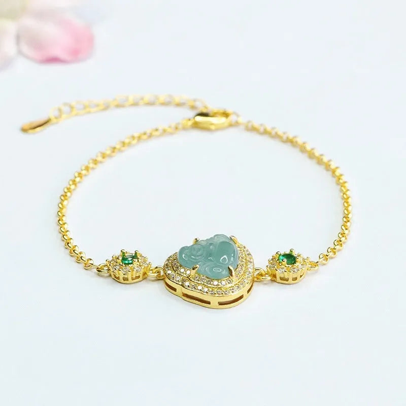 Women's jade bracelet with an inlaid blue Maitreya Buddha charm measuring 10mm by 13mm.