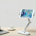 Aluminum alloy sucker bracket with double suction cup holding a tablet on a smooth surface, multi-angle rotation visible