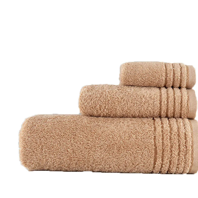 Cotton towel set showing bath, hand and face towels in beige or brown colours