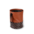 Leather retractable car trash can shown in folding design with carry handle