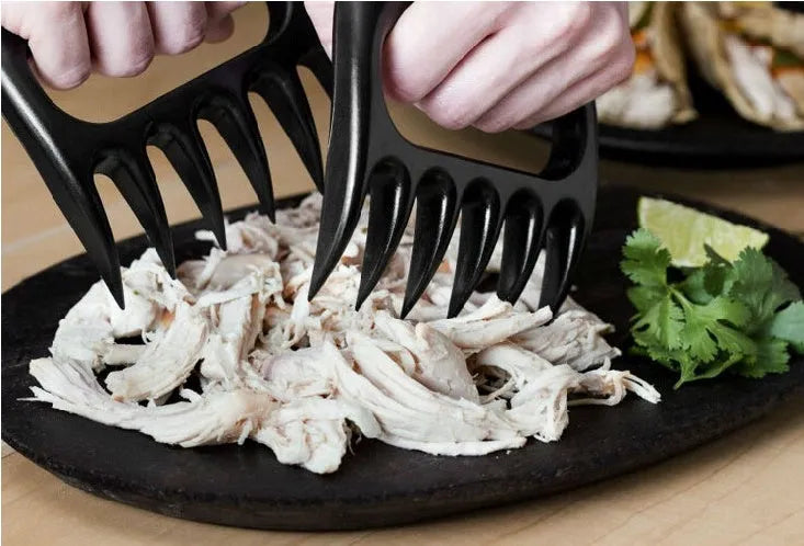 Black barbecue meat claw fork set with decorative patterns for meat shredding and food preparation