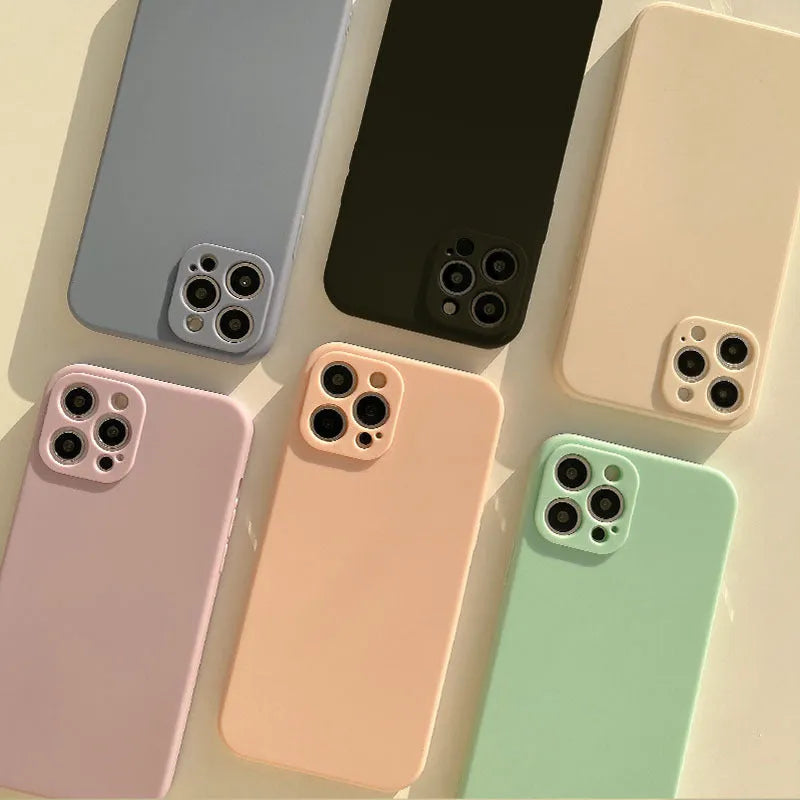 Frosted matte silicone phone case for iPhone 14 on a table, showing the slate blue colour option.