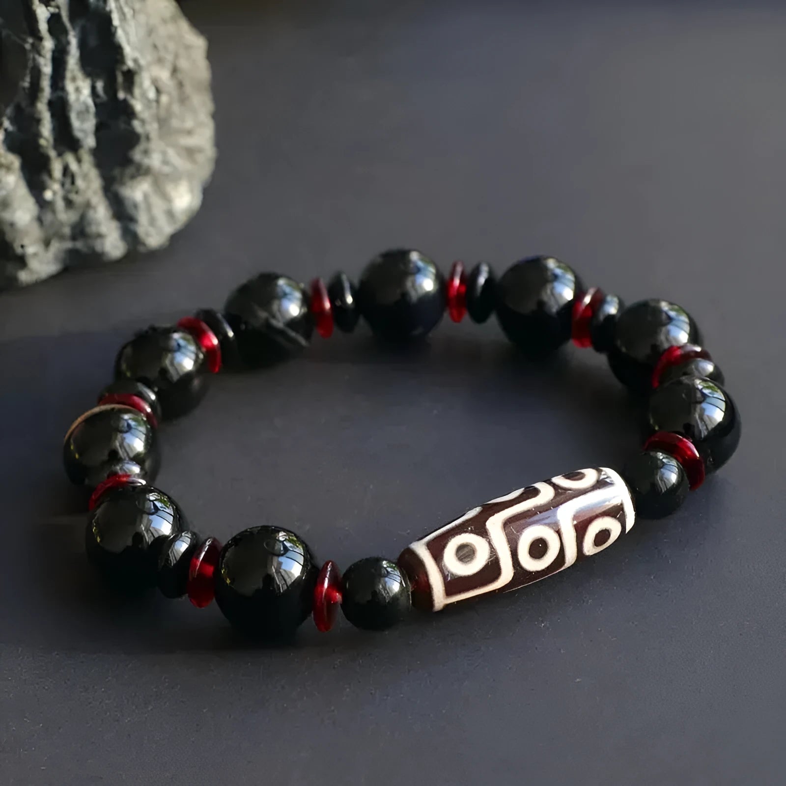Black agate dzi bead bracelet with 11mm geometric beads and hand-woven construction